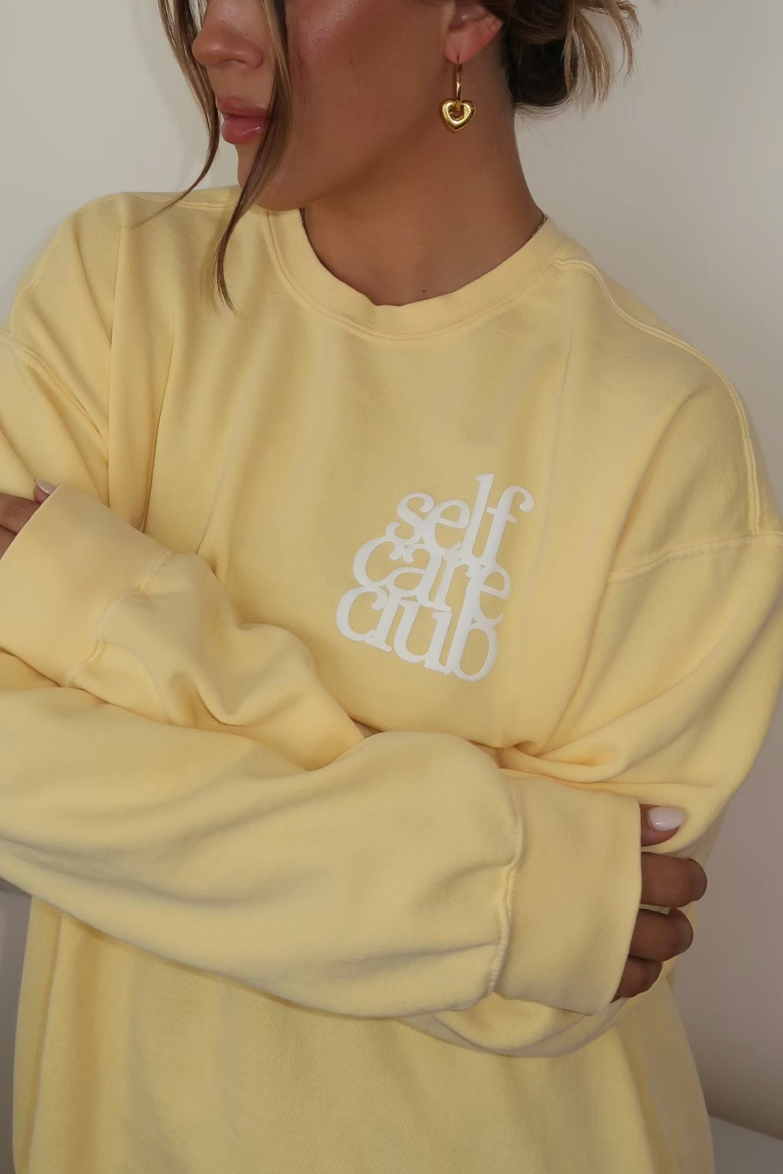 YELLOW SELF CARE CLUB CREWNECK